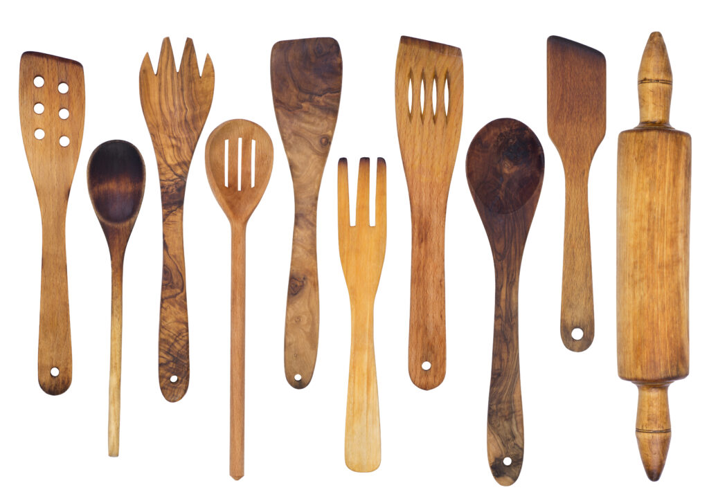 A photo of several wooden spoons, spatulas, and a rolling pin.