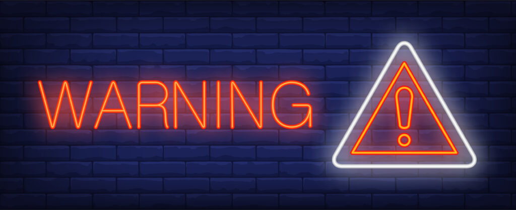 "Warning" in neon with a danger sign