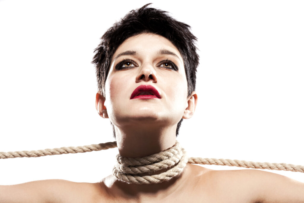 Woman with rope around her neck