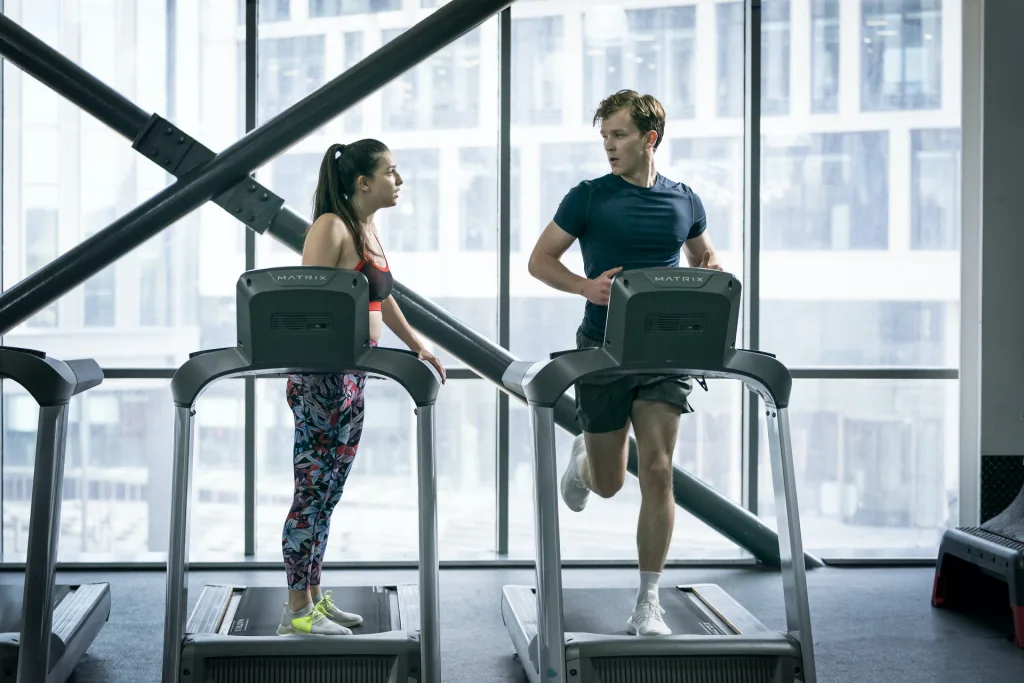 Yasmin and Robert from Industry standing next to each other on treadmills