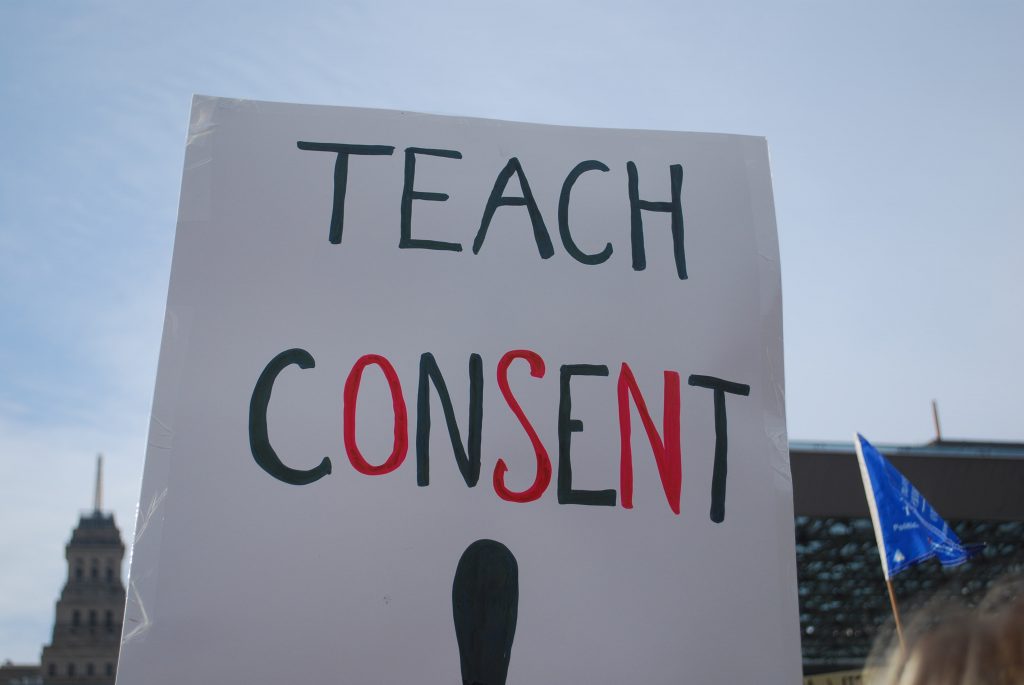 Sign reading "Teach Consent"