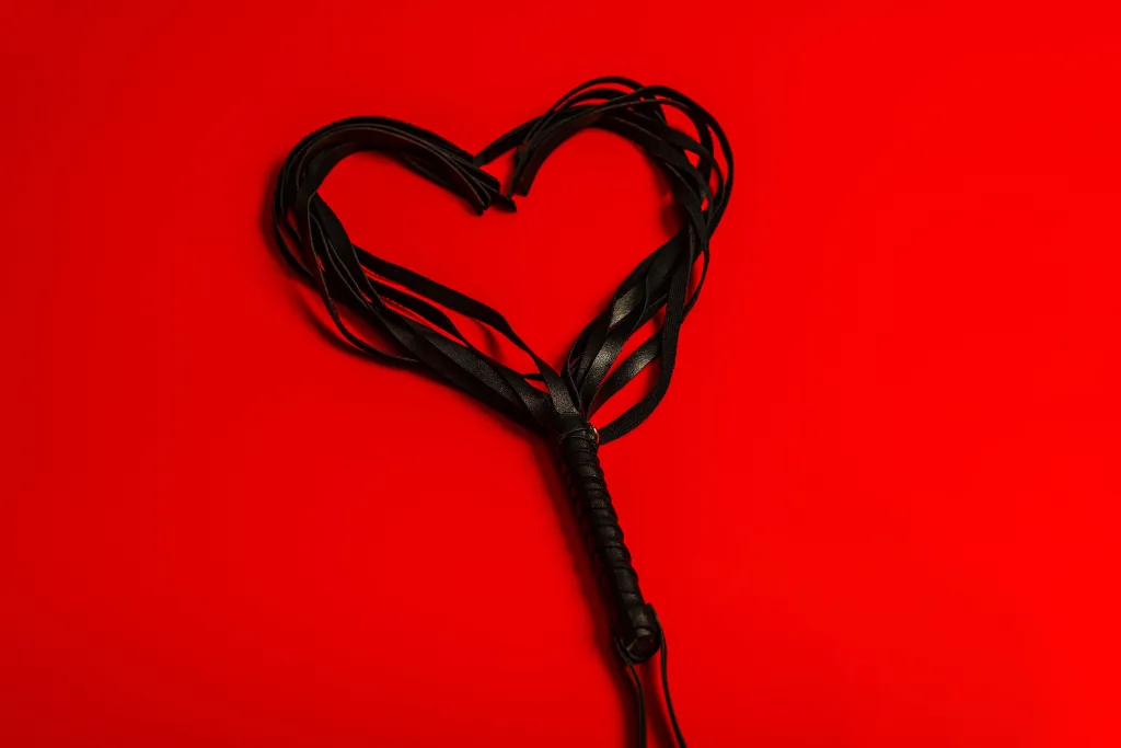 A flogger arranged in the shape of a heart